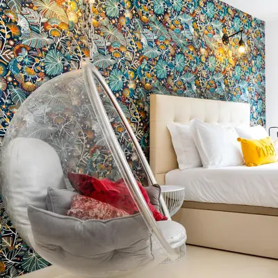 a bedroom with a bed and a swing at Boavista Loft in Porto