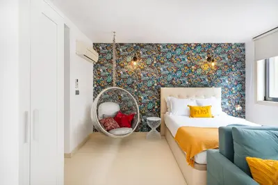 a bedroom with a bed and a mirror at Boavista Loft in Porto