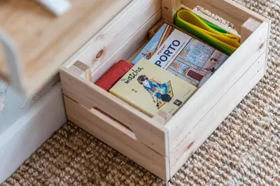 a wooden crate filled with books and other items at Good Vibes Only by LovelyStay in Porto