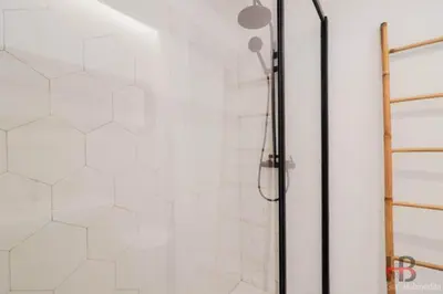 a bathroom with a shower with white tiles at Good Vibes Only by LovelyStay in Porto