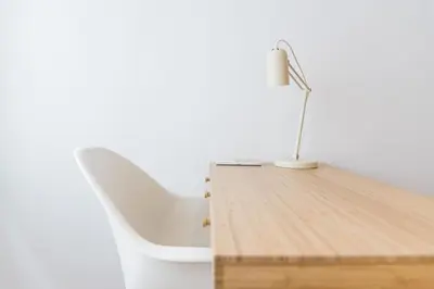 a desk with a white chair and a lamp on it at Good Vibes Only by LovelyStay in Porto
