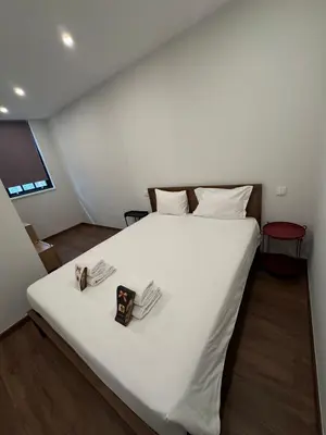 a bedroom with a large white bed with white sheets at River Apartment in Porto