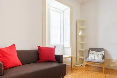 a dining room with a table and chairs at GuestReady - Historic Courtyard Townhouse in Porto