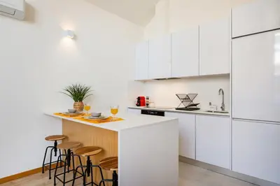 a toilet seat with a ruler on it in a bathroom at Duque de Saldanha Duplex Loft in Porto