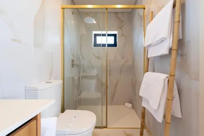 a bedroom with a white bed and a wall at DoisPontoZero Júlio Dinis Gold in Porto
