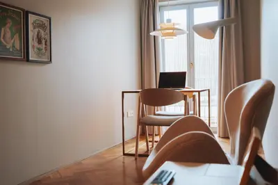 a living room with a couch and a table with a laptop at Domum 4 in Porto