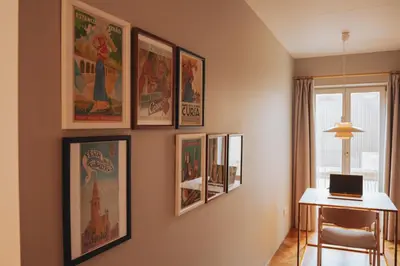 a room with a bunch of pictures on the wall at Domum 4 in Porto