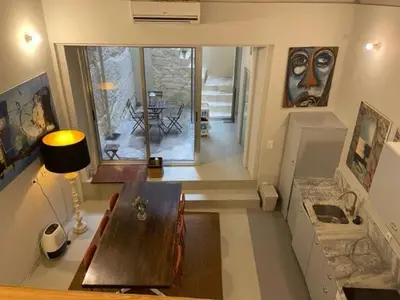 a living room with a wooden table in a room at Aliados Historic Downtown Apartments by LuxiStay in Porto