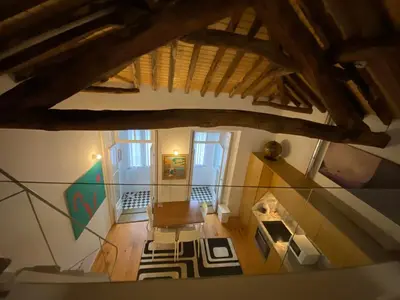 an overhead view of a living room with a table and a fireplace at Aliados Historic Downtown Apartments by LuxiStay in Porto