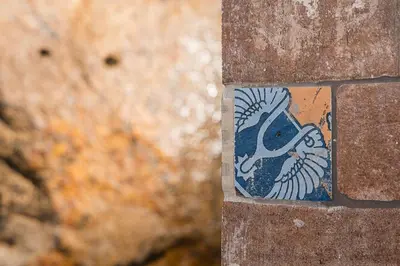 a sticker of a fish on a brick wall at GuestReady - Serene Hideout in Downtown in Porto