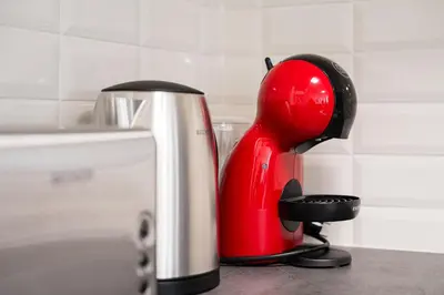a red mixer sitting on top of a counter at GuestReady - Serene Hideout in Downtown in Porto