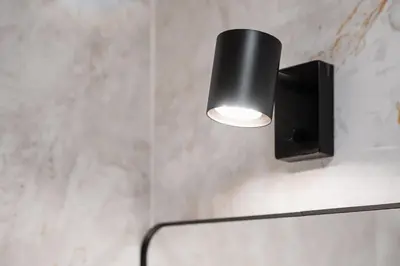 a light and a speaker on a wall at GuestReady - Serene Hideout in Downtown in Porto