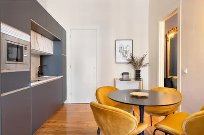 a kitchen and dining room with a table and chairs at 42 1T Cardosas Block Historic Ap in Porto