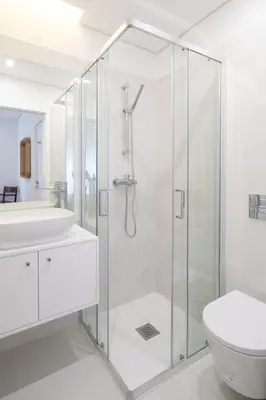 a bathroom with a shower and a toilet and a sink at GuestReady - Modern 2-Bedroom Apt in Cedofeita in Porto