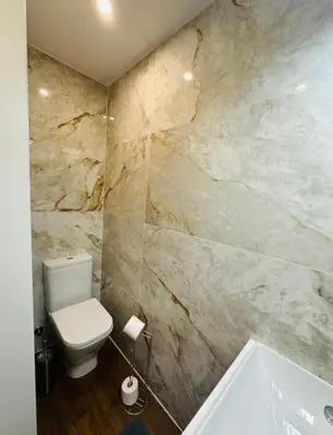a bathroom with a toilet and a bath tub at Bridge Apartment in Porto
