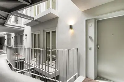 a hallway of a building with a staircase and a door at GuestReady - Trendy getaway in the heart of Porto in Porto