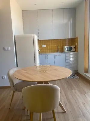 a kitchen with a wooden table and two chairs and a table at Peter Terrace - Rio Douro & Caves Vinho do Porto in Bandeira