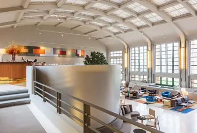 a large lobby with a large ceiling at Vincci Porto in Porto