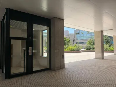 an entrance to an office building with glass doors at ML Porto Plaza Avenue in Porto