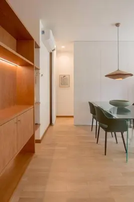 a dining room with a table and green chairs at Dixo's Oporto Apartments Duplex in Porto