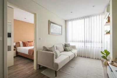 a living room with a couch and a bed at Cedofeita Bliss - 1BDR with AC in Porto