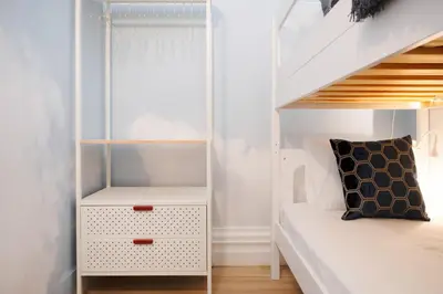a small bedroom with a bunk bed and a staircase at Cardosas Block Luxury Apartment in Porto