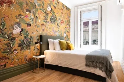 a bedroom with a large floral wall mural at Cardosas Block Luxury Apartment in Porto