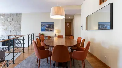 a dining room with a table and chairs at Mouzinho's Place by LovelyStay in Porto