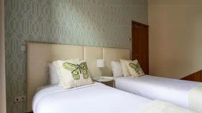 two beds sitting next to each other in a room at Mouzinho's Place by LovelyStay in Porto