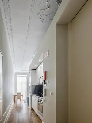 a kitchen with a white ceiling and a dining room at Oporto View Apartments in Porto