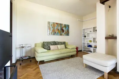 a living room with a couch and a stool at LV Premier Apartments Clerigos- RE1 in Porto