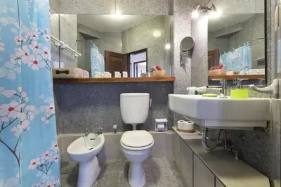 a bathroom with a toilet and a sink at LV Premier Apartments Clerigos- RE1 in Porto