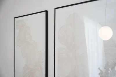 two framed pictures with a window and a curtain at GuestReady - Porto's Modern Comfort in Porto