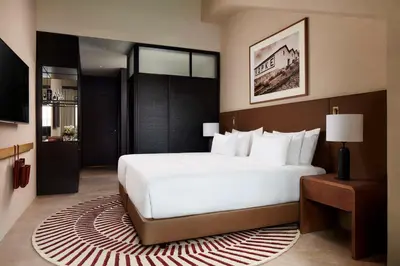 a hotel room with a large bed and a window at Tivoli Kopke Porto Gaia Hotel in Vila Nova de Gaia
