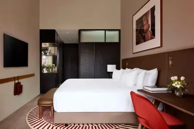 a hotel room with a large bed and a desk at Tivoli Kopke Porto Gaia Hotel in Vila Nova de Gaia