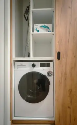 a washing machine in a room with a door at The Cale - Antero de Quental - 11 in Porto