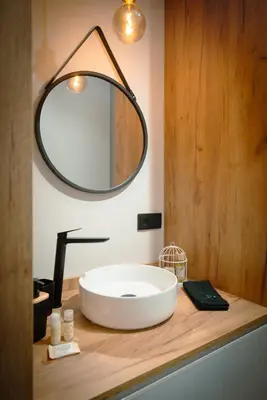 a bathroom with a sink and a mirror on a counter at The Cale - Antero de Quental - 11 in Porto