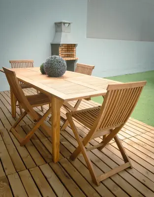 a wooden table with two chairs and a plant on it at The Cale - Antero de Quental - 11 in Porto