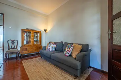 a door leading to a patio with a table and chairs at Patio House - 2 Bedroom flat - Pet Friendly in Porto