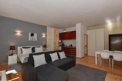 a living room with a couch and a bed at Almada Apartments 468 in Porto