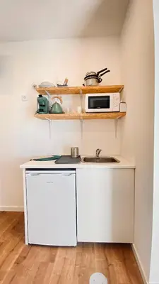 a room with two bunk beds and a desk at Raul Dória - Guesthouse in Porto