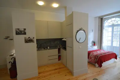 a bedroom with a bed and a mirror on the wall at Oporto Almada 329 in Porto