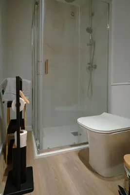a bathroom with a shower and a white tub at The Cale - Antero de Quental - 12 in Porto