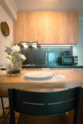 a kitchen counter with a table with a plate on it at The Cale - Antero de Quental - 21 in Porto