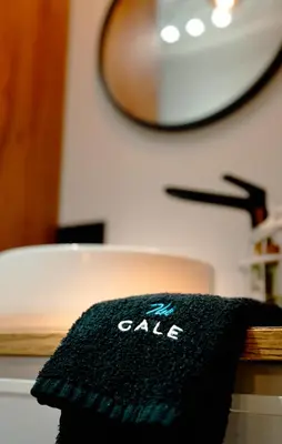 a black towel is sitting on a table at The Cale - Antero de Quental 22 in Porto