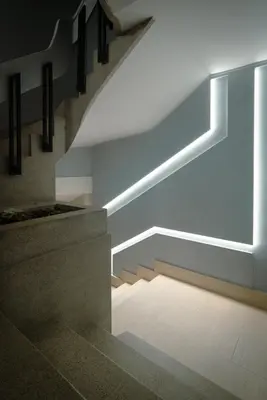 a staircase in a building with lights on it at The Cale - Antero de Quental 22 in Porto