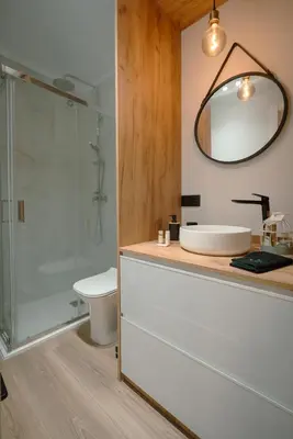 a bathroom with a toilet and a sink and a mirror at The Cale - Antero de Quental 31 in Porto