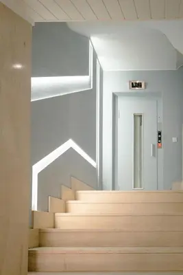 a staircase in a building with a stair case at The Cale - Antero de Quental 32 in Porto