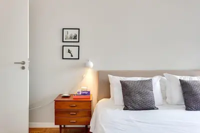 a bedroom with a bed with towels on it at Duque da Terceira Apartment in Porto
