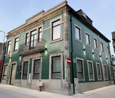 an office with a fax machine next to a refrigerator at Oporto Station Hostel & Rooms in Porto